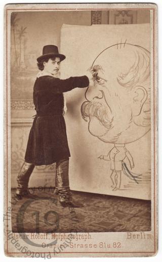 Young man drawing a caricature