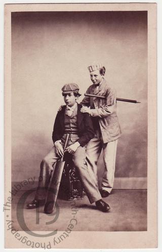 Two boys with cricket bats