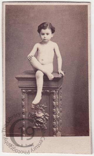 Naked boy on pedestal