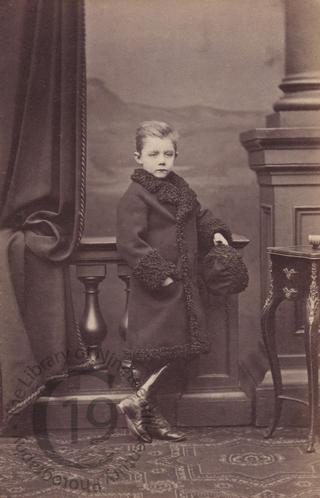 Unidentified boy in fur-lined coat