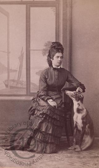Young woman with greyhound