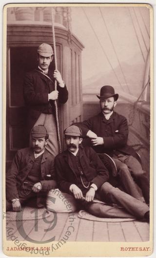 Four men on the Isle of Bute