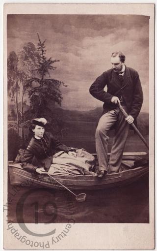 Couple in fake rowing boat