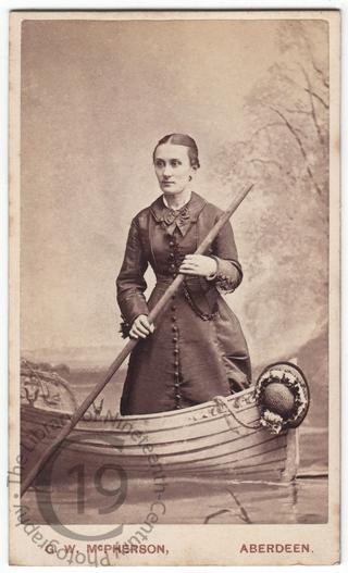 Woman in a fake rowing boat