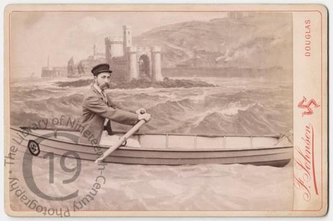 Man in a fake rowing boat