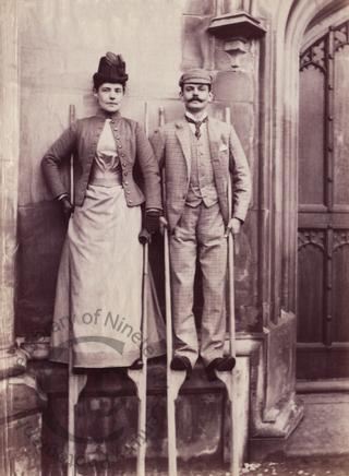 Unidentified couple on stilts