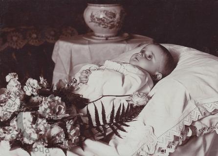 Baby with white flowers