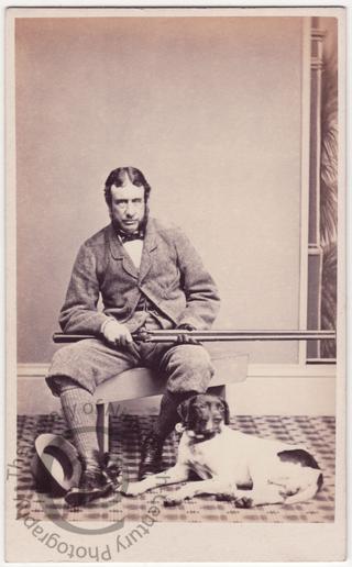 Man with dog and gun