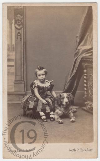 Unidentified child with dog