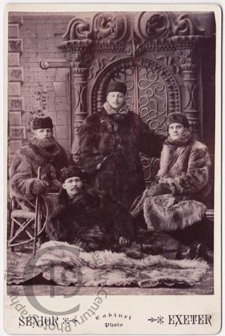 Four men in fur coats