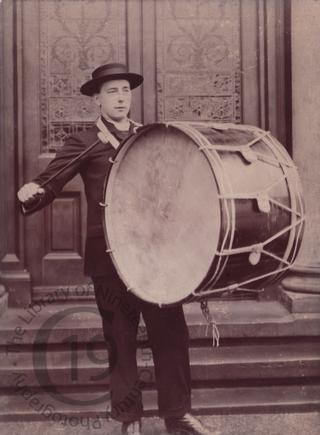 Young man with bass drum