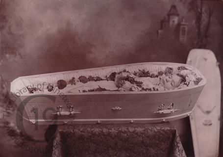 A child in a white coffin