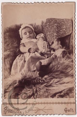 Small girl with doll