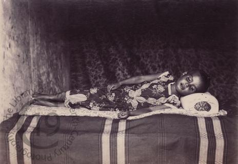 Burmese girl on a bed