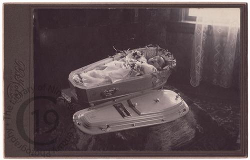Baby in white coffin