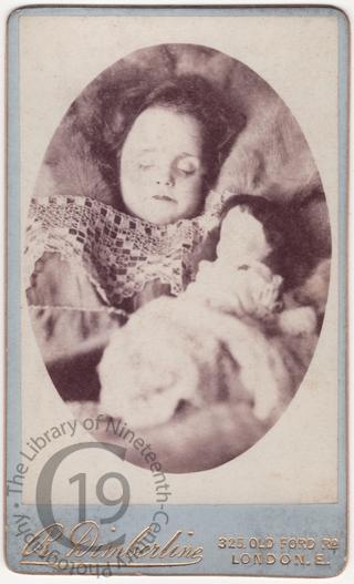 A young girl with a doll
