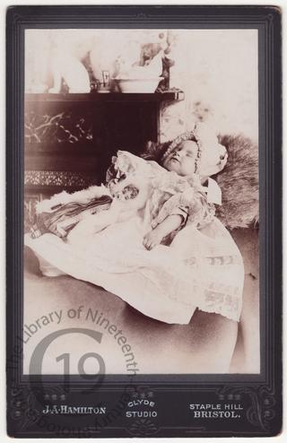 A small girl with a doll