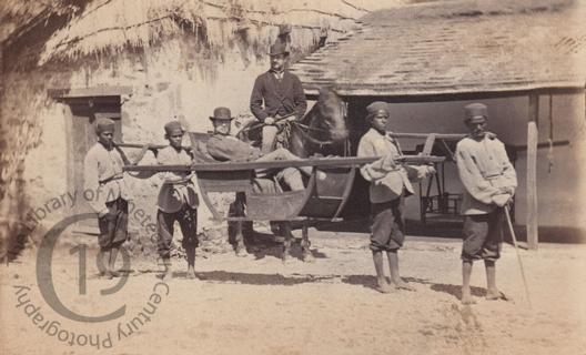 Man in uncovered palanquin