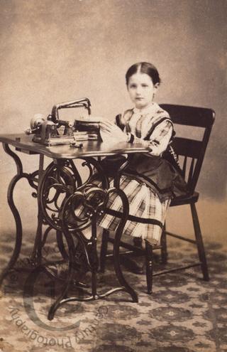Girl with sewing machine