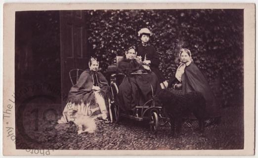 Elderly woman in bath chair