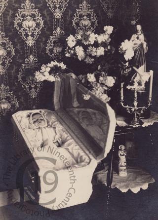 Baby with reflection and ornaments