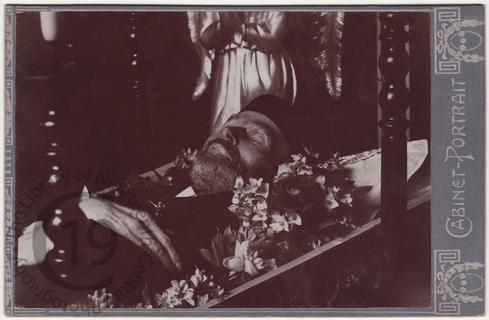 Man in fez with angel statue
