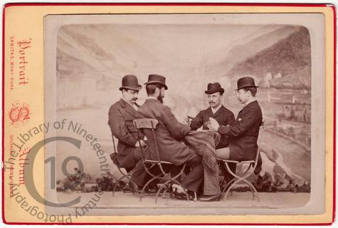 Four men playing cards